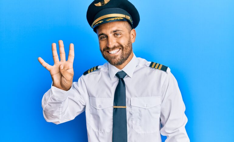 A-NAVY-CAPTAIN-SIMLING-AND-SHOWING-HIS-FOUR-FINGER